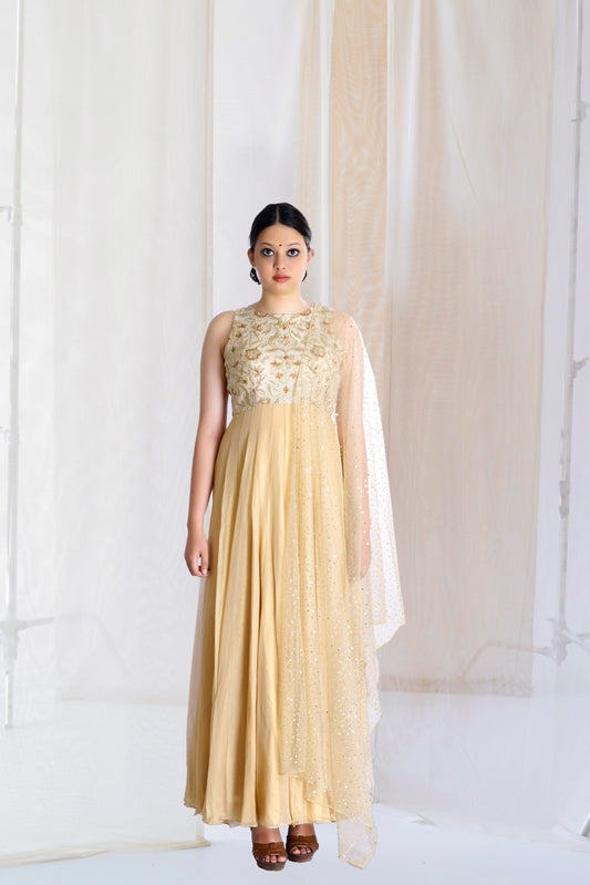 beige and gold kurta set with flare and indian embroidery and motifs made in sleeveless form
